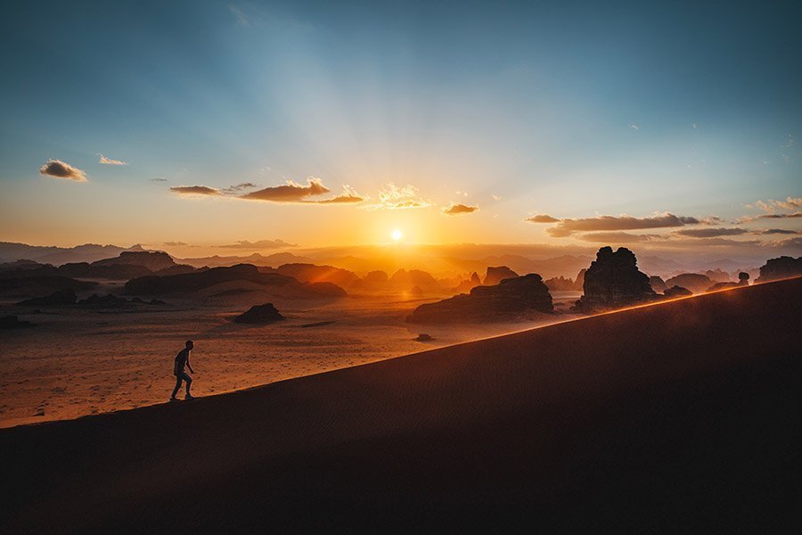 Hiking in the desert at sunset