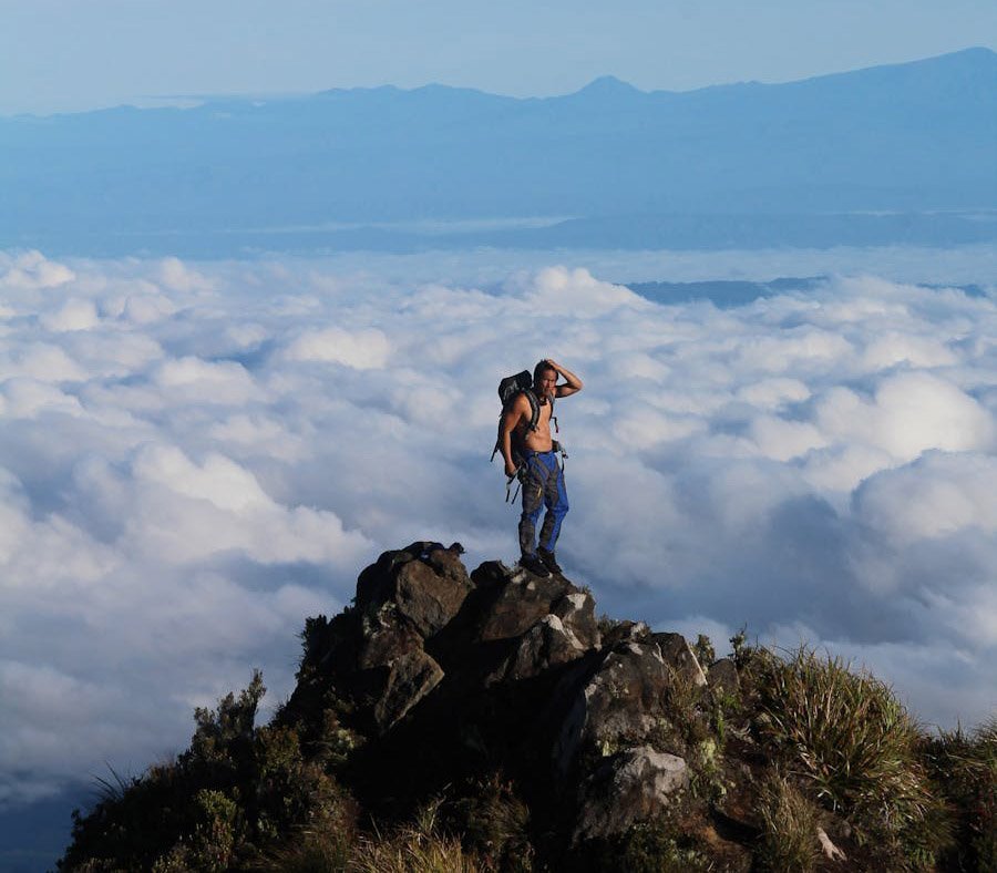 man hiking topless