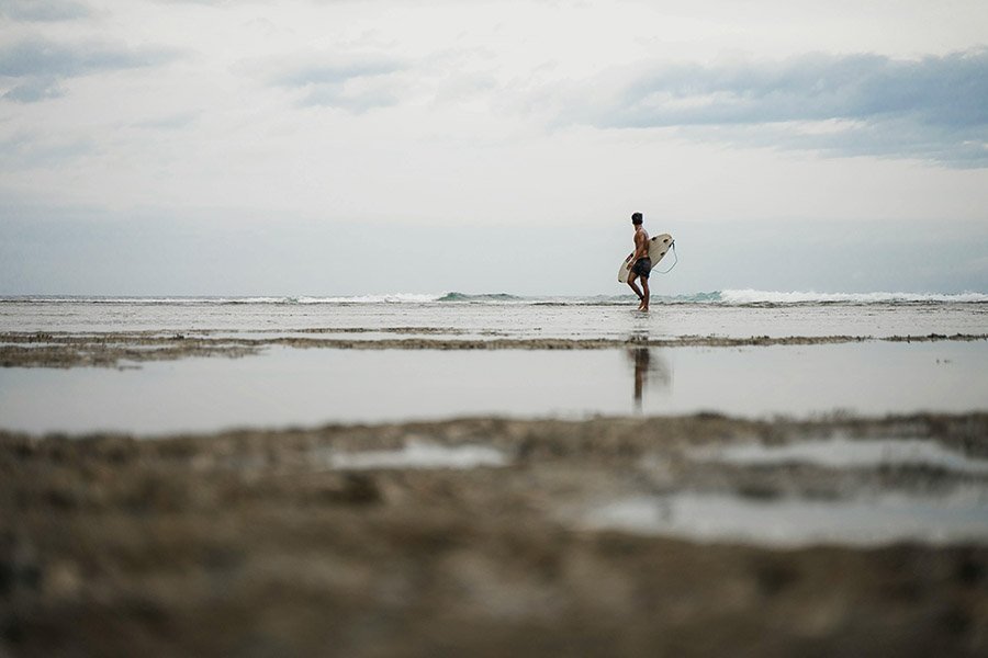 Surfer on the shore of Siargao