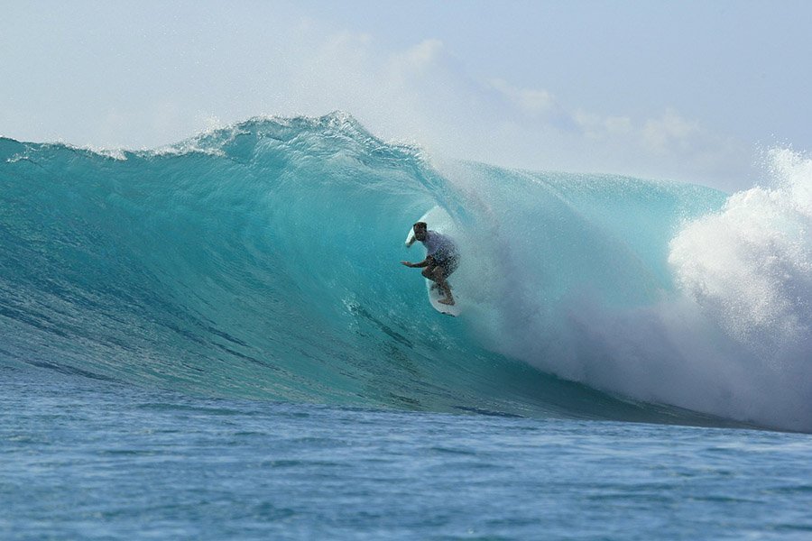 Surfer in huge wave