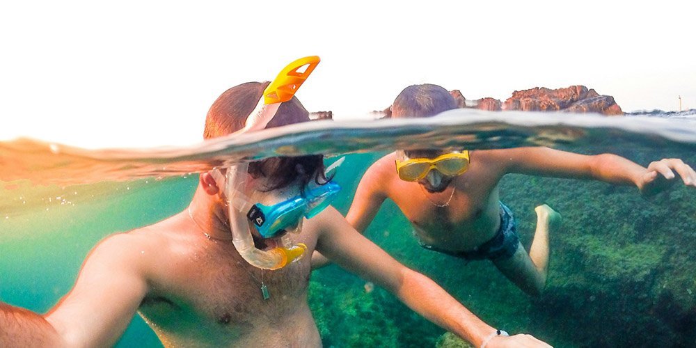 Swimmers using dry snorkels